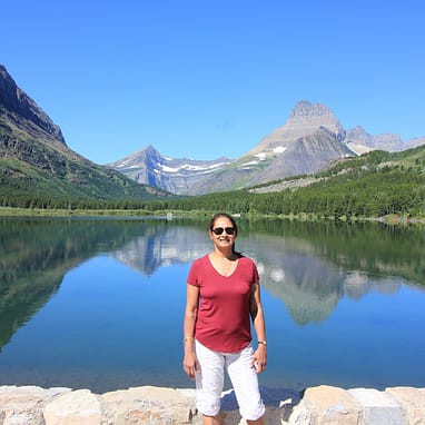 About me-This is me in Glacier National Park in front of one of the gorgeous lakes there.
