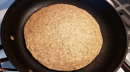 Top of pancake is dry so it can be flipped over