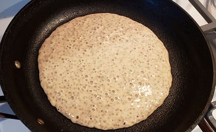 Fiber-rich pancake batter just poured into the skillet
