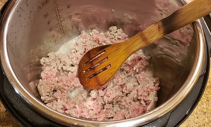 1 pound ground turkey being browned in the instant pot